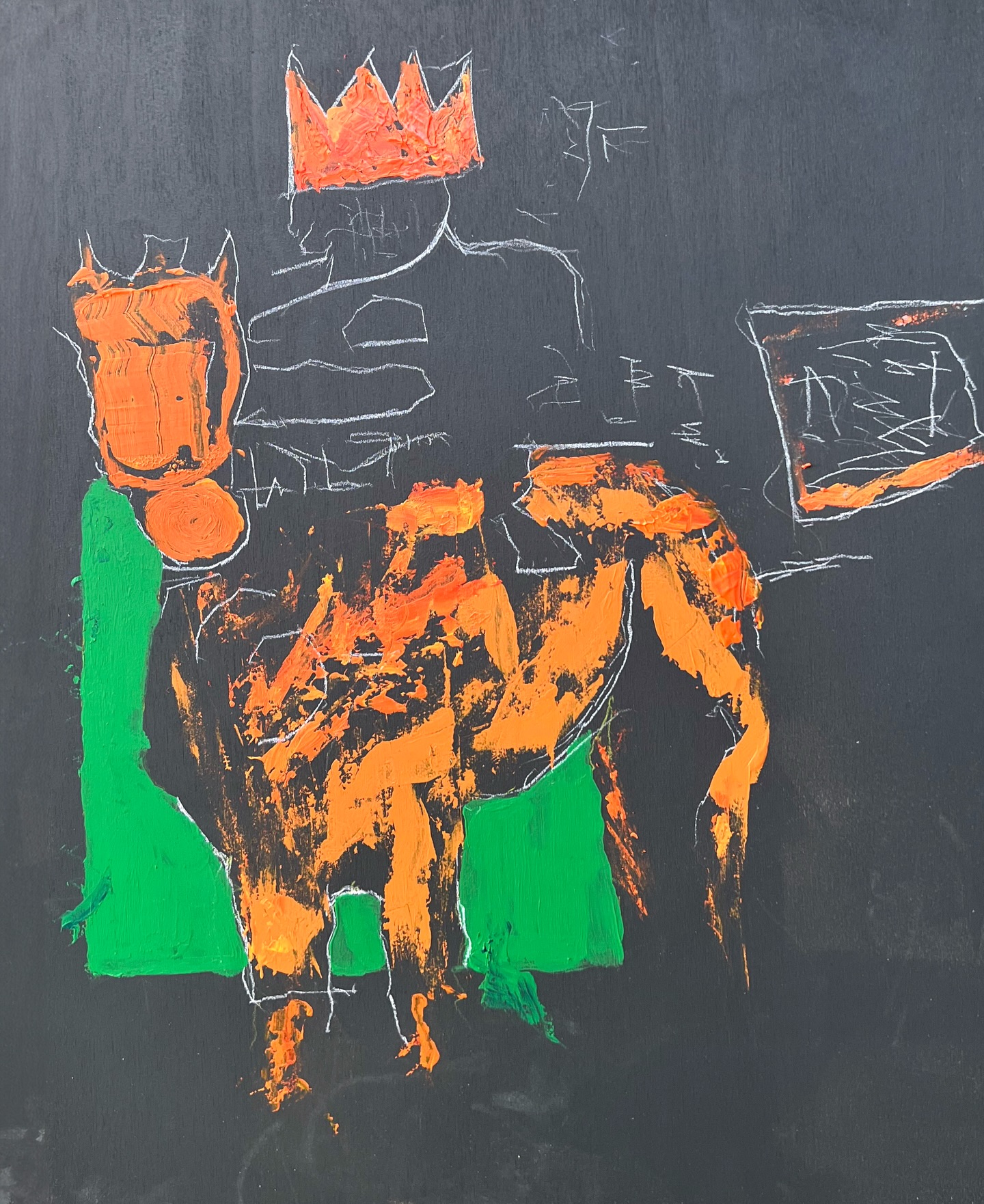 Orange and green studio painting on a dark surface
