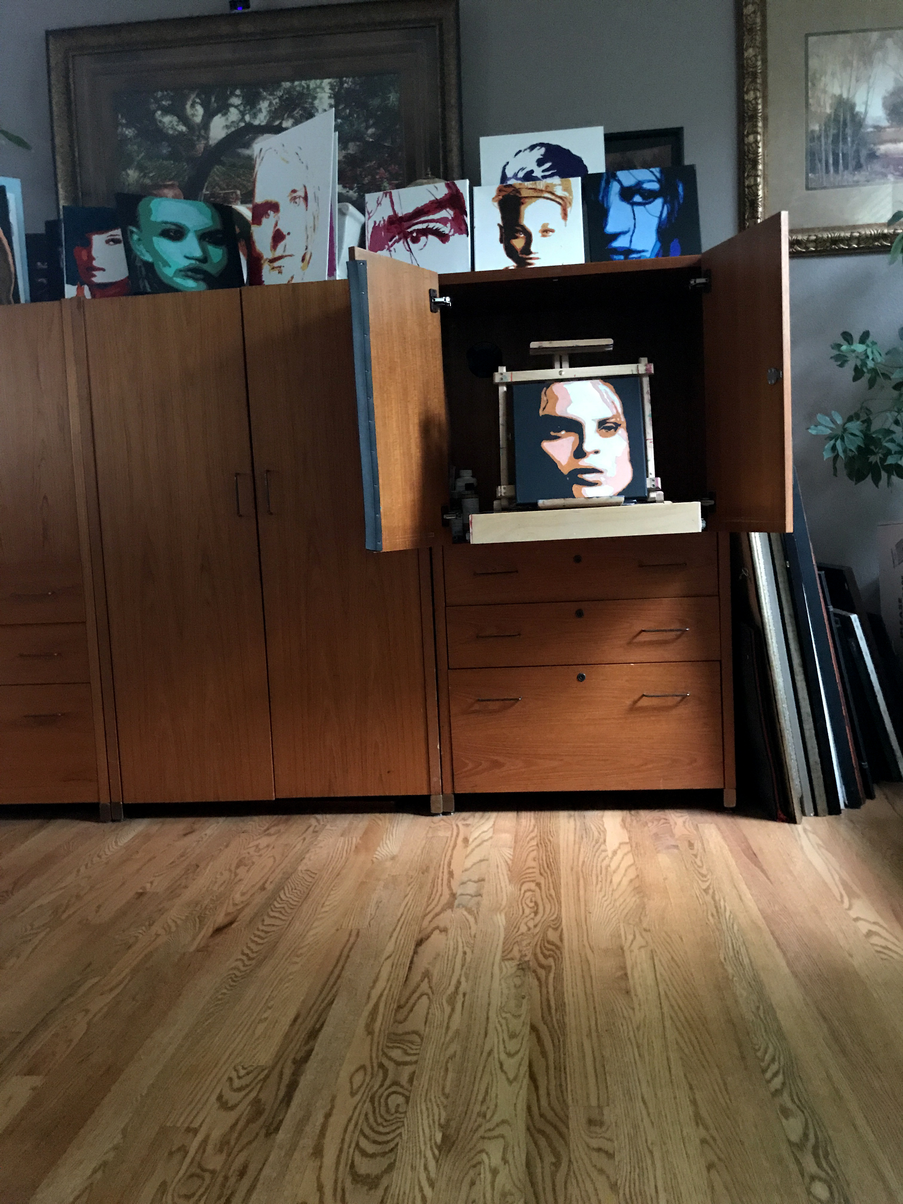 Studio cabinet with painted portrait originals