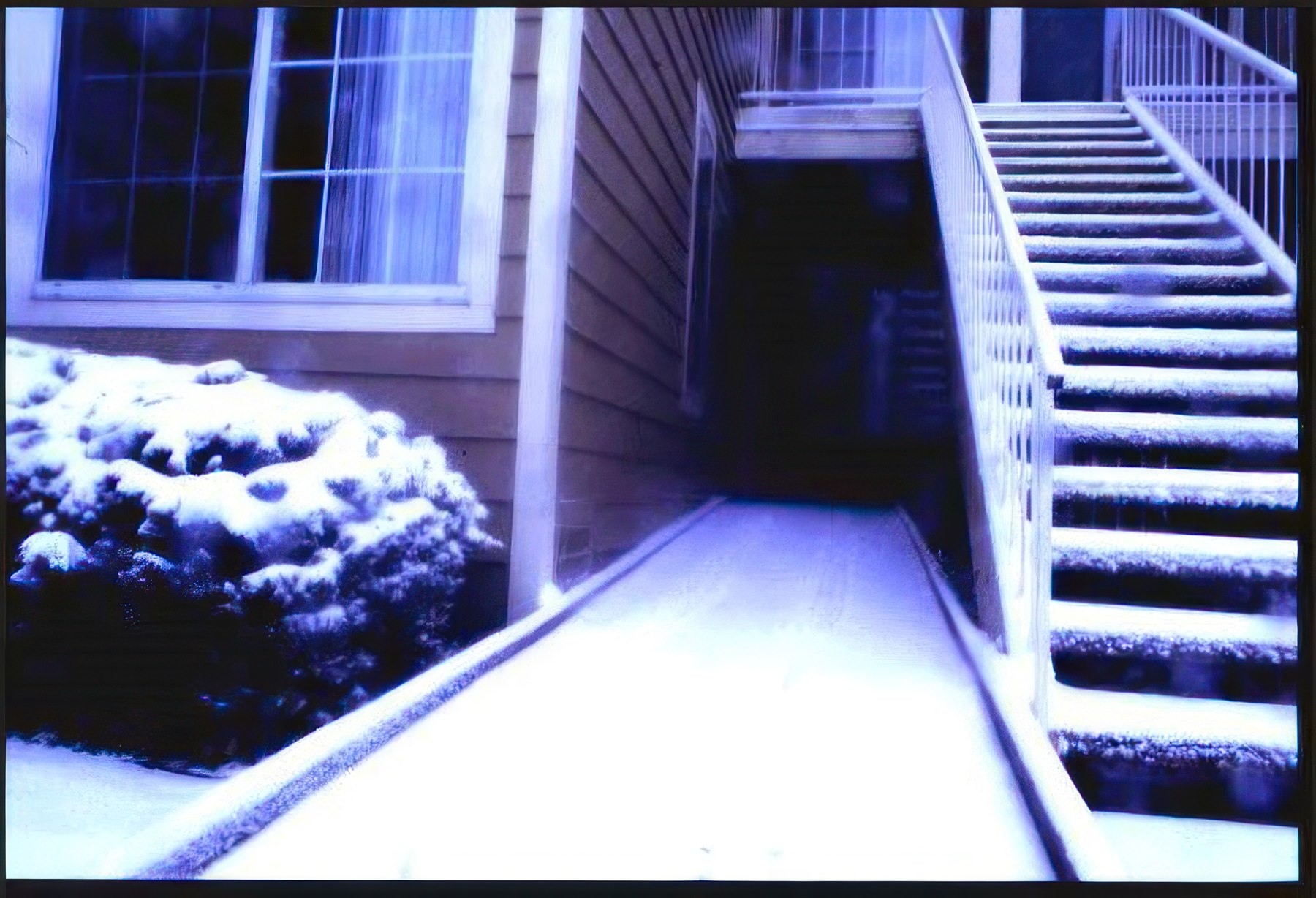 Snow-covered accessible ramp and stairs